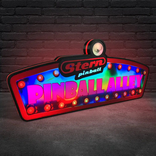 Colorful lightbox sign with 'Stern Pinball Pinball Alley' text against a brick wall.