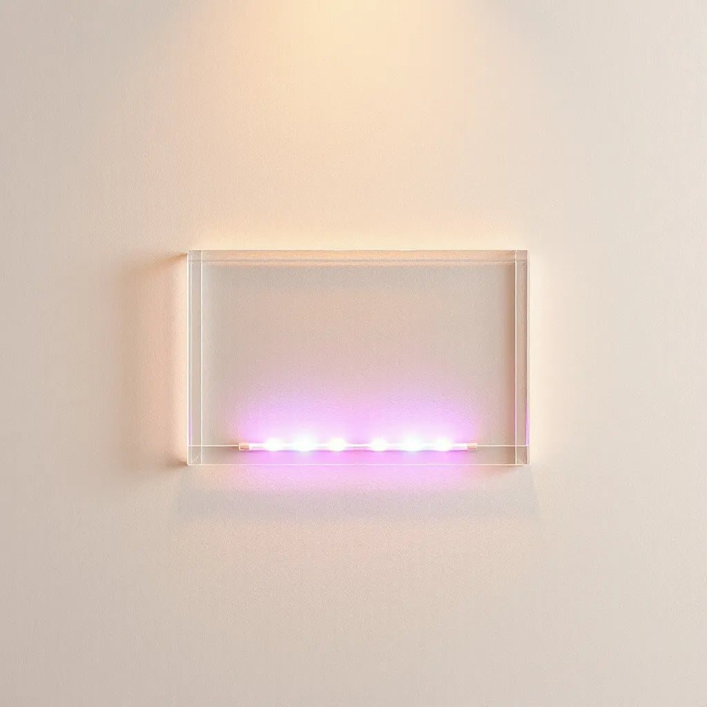 Layered acrylic LED topper glowing softly against a neutral wall with subtle reflections