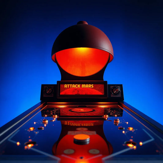 Dome-style Attack From Mars inspired pinball topper glowing above the playfield in a dark blue space setting