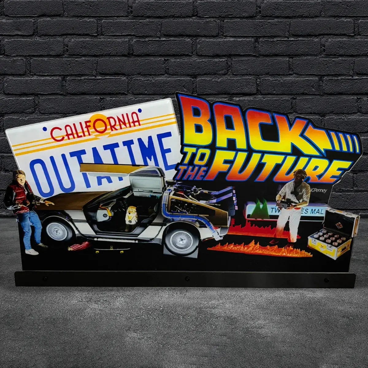 Decorative sign with 'Back to the Future' theme featuring a time machine and characters against a brick wall.
