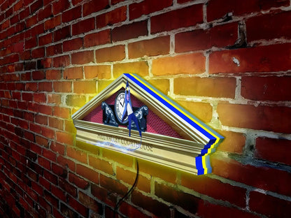 3D printed LED lightbox with a design featuring a character from the movie Back to the Future, mounted on a brick wall.
