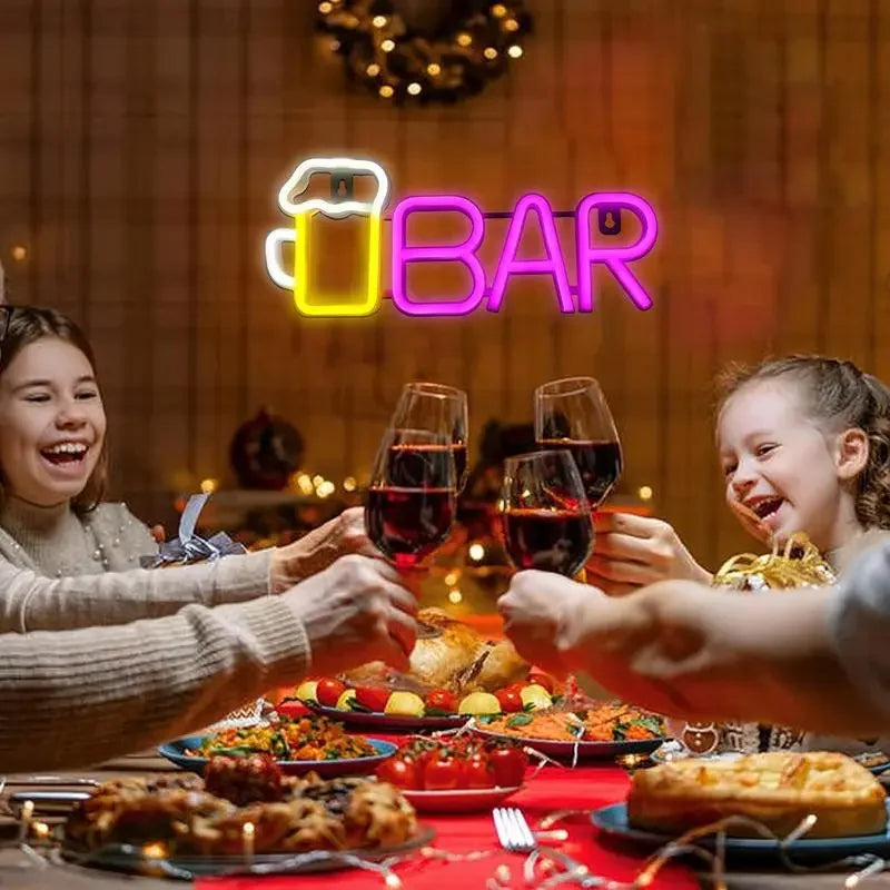 Neon 'BAR' sign with beer mug, glowing above festive dinner table with wine glasses and family toasting