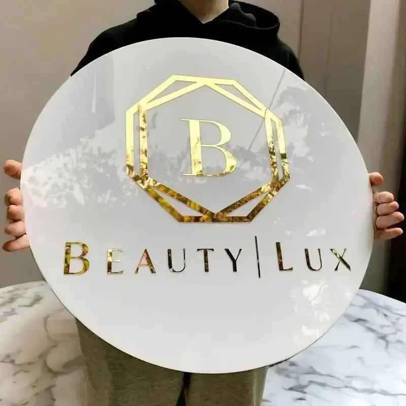 Custom round neon sign with gold 'B' logo and 'BEAUTY | LUX' text, ideal for boutique or salon decor