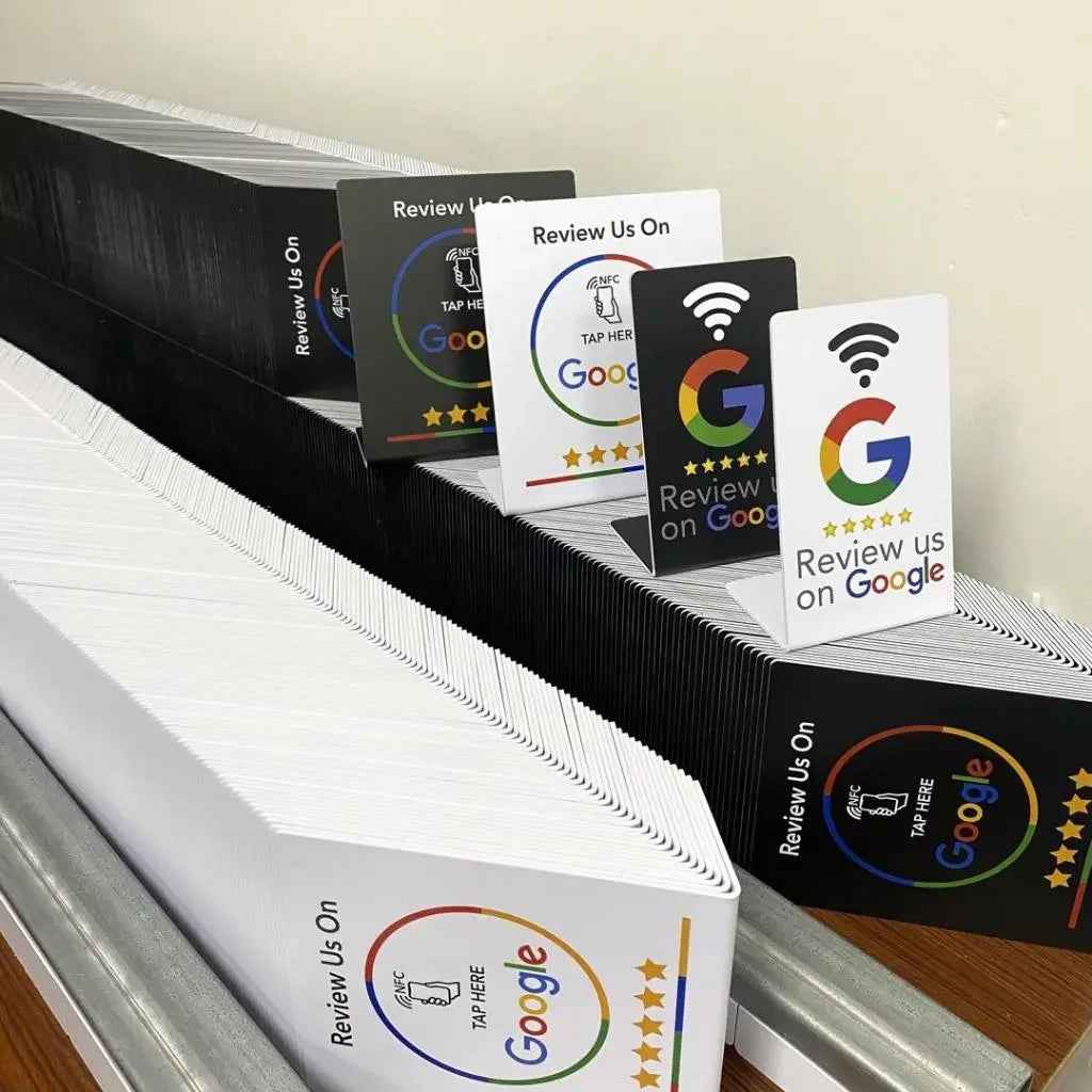 Google review cards with NFC tap feature for customer feedback, black and white designs stacked neatly